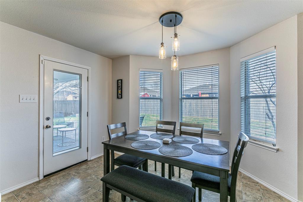 3433 Charing Cross Road Midlothian, TX 76065 - Photo 10 of 27 a view of a dining room with furniture wooden floor and chandelier