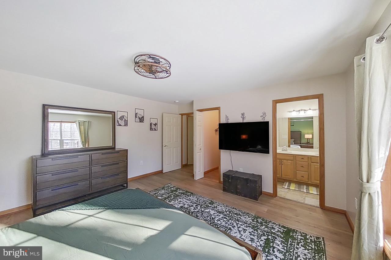 1122 Ranger Trail Pocono Lake, PA 18347 - Photo 24 of 48 Serene bedroom with modern touches.