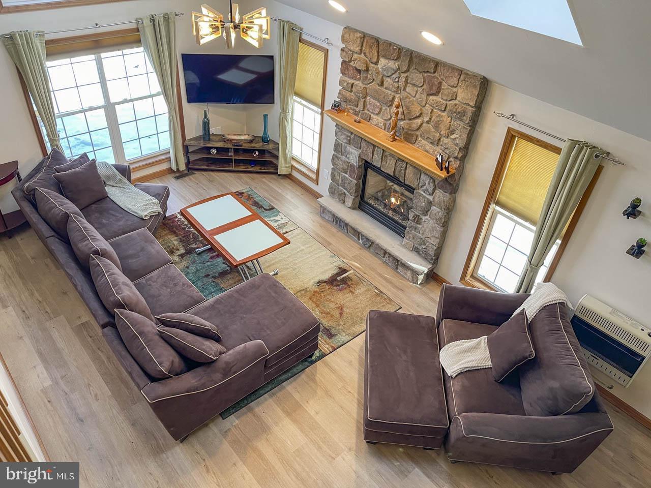 1122 Ranger Trail Pocono Lake, PA 18347 - Photo 3 of 48 Cozy living space with stone fireplace.