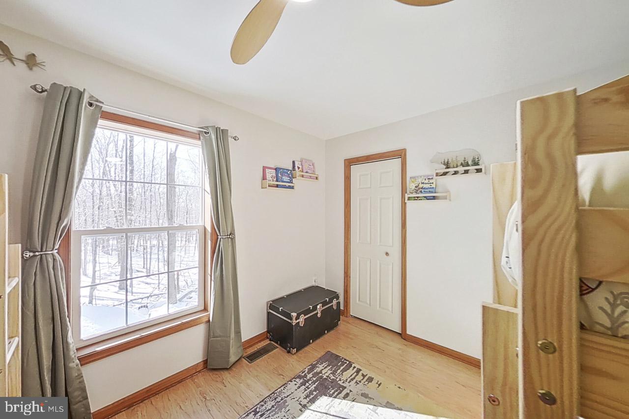 1122 Ranger Trail Pocono Lake, PA 18347 - Photo 34 of 48 Bright and airy woodland retreat.