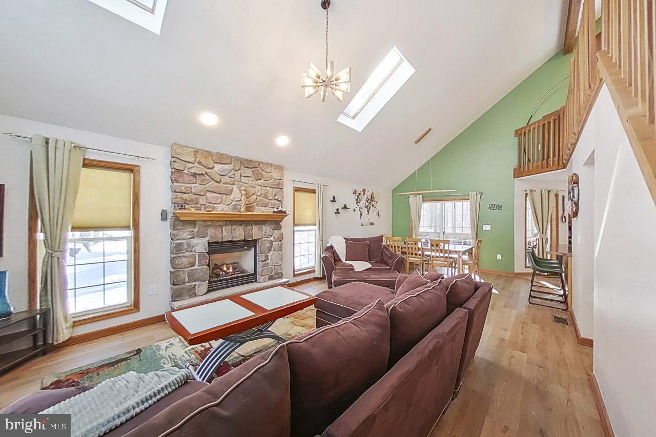 1122 Ranger Trail Pocono Lake, PA 18347 - Photo 6 of 48 Cozy living space with stone fireplace.