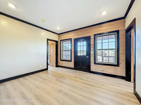 a view of an empty room and window