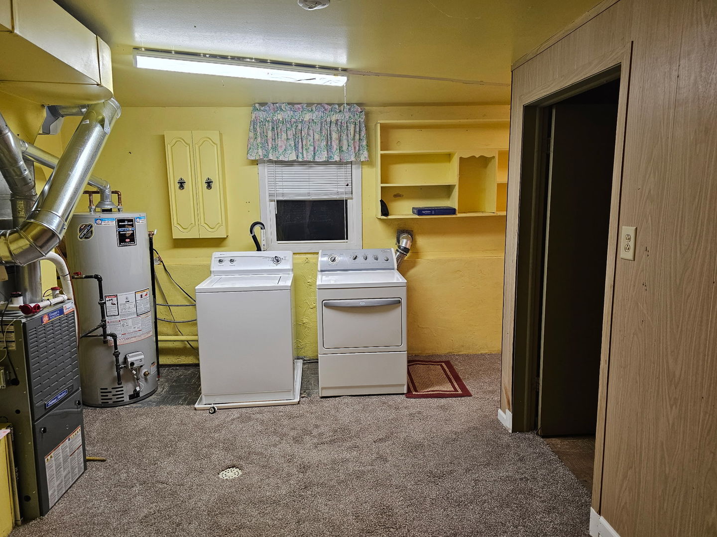 426 Thunderbird Trail Carol Stream, IL 60188 - Photo 18 of 34 a room with a washing machine and a fireplace
