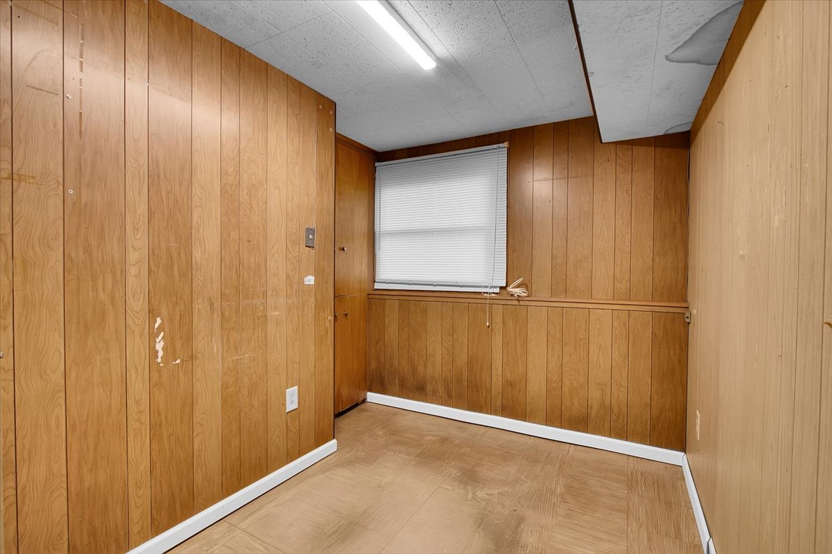 426 Thunderbird Trail Carol Stream, IL 60188 - Photo 23 of 34 a view of a hallway with wooden walls