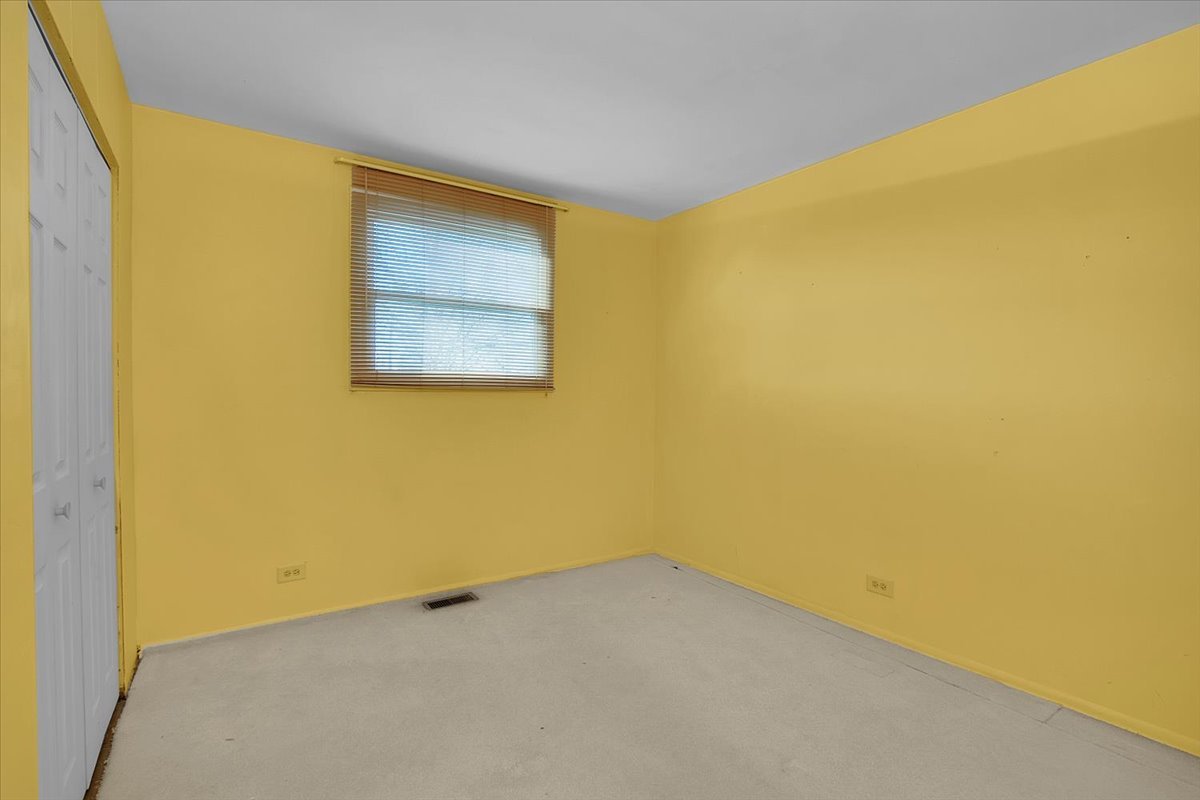 426 Thunderbird Trail Carol Stream, IL 60188 - Photo 31 of 34 a view of an empty room with a window