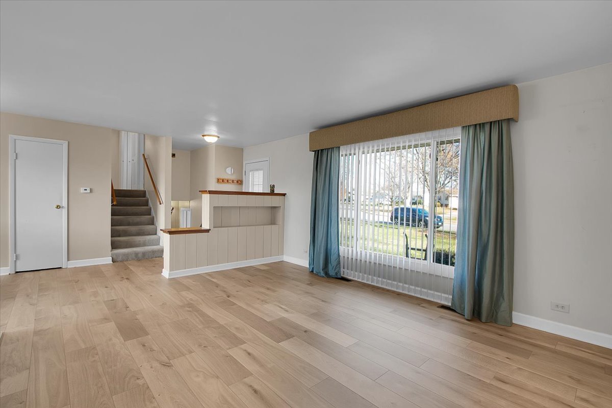 426 Thunderbird Trail Carol Stream, IL 60188 - Photo 8 of 34 a view of an empty room with a window