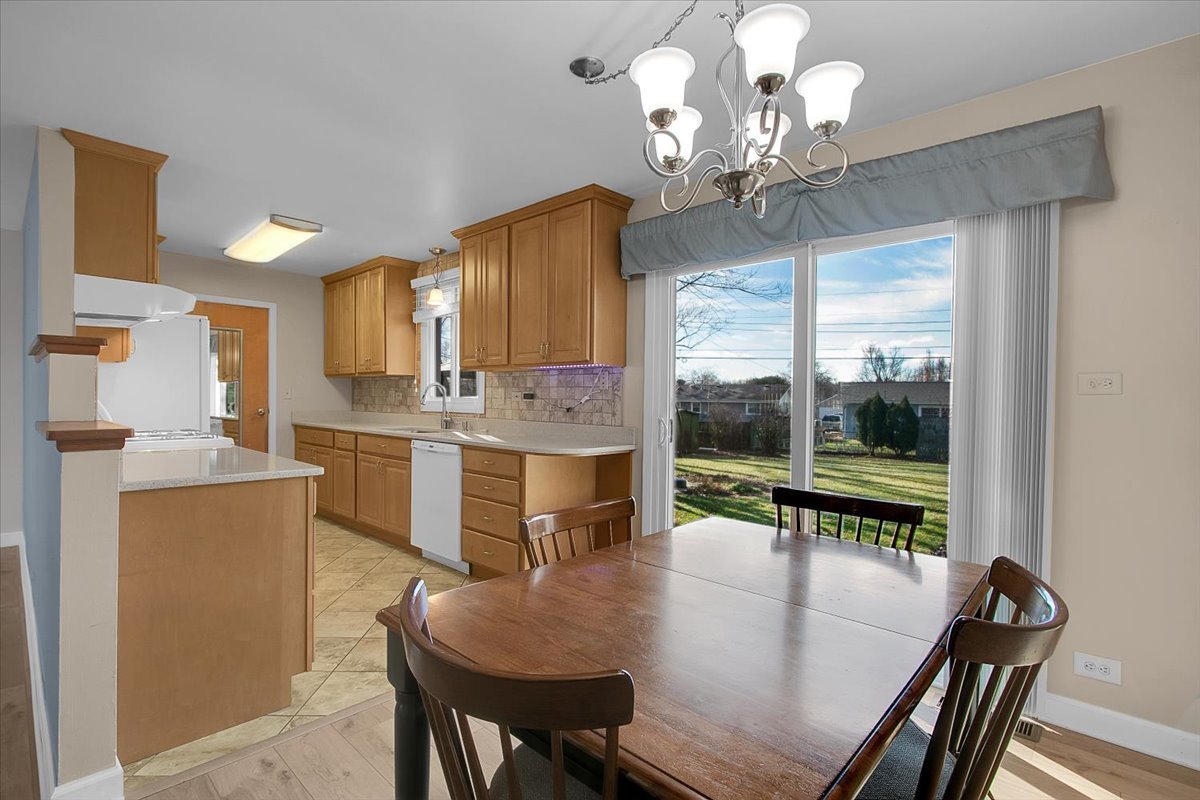 426 Thunderbird Trail Carol Stream, IL 60188 - Photo 10 of 34 a view of a dining room with furniture window and outside view