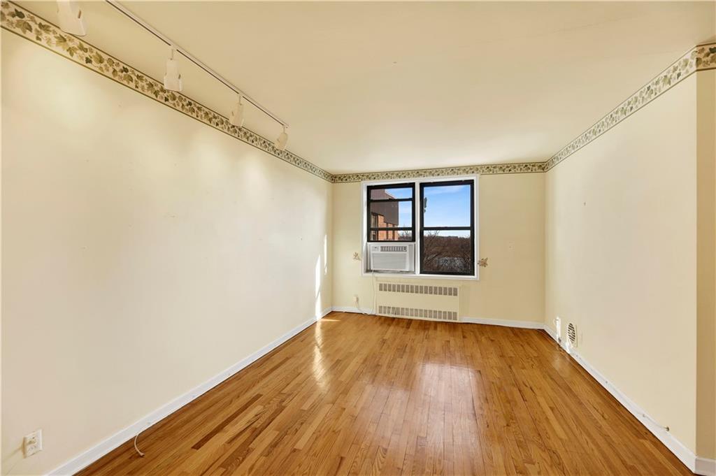 2260 Burnett Street, Unit 6K Brooklyn, NY 11229 - Photo 3 of 17 a view of a room with wooden floor and white walls