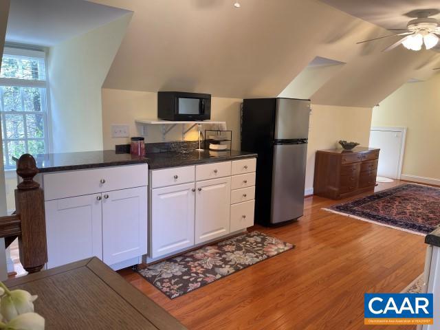1920 Owensville Road, Unit B Charlottesville, VA 22901 - Photo 18 of 26 a kitchen with stainless steel appliances granite countertop a sink stove and refrigerator