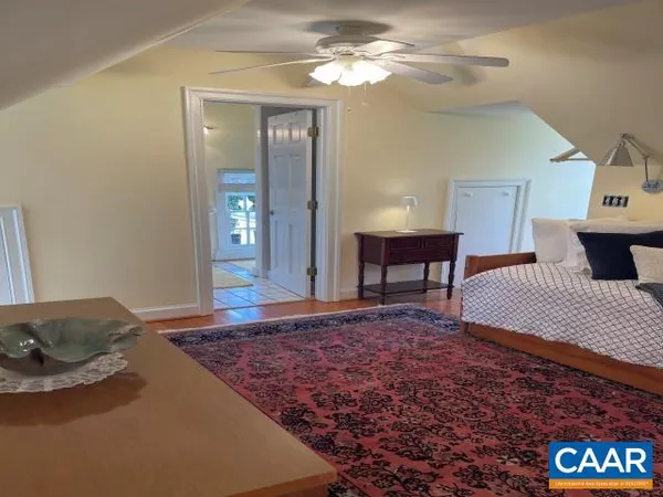 a living room with a couch and chandelier