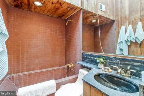 a bathroom with a sink and a bathtub