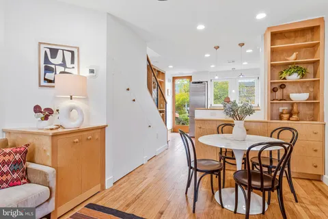 a view of a dining room with furniture window and wooden floor