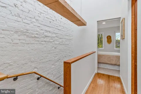 a view of balcony with wooden floor