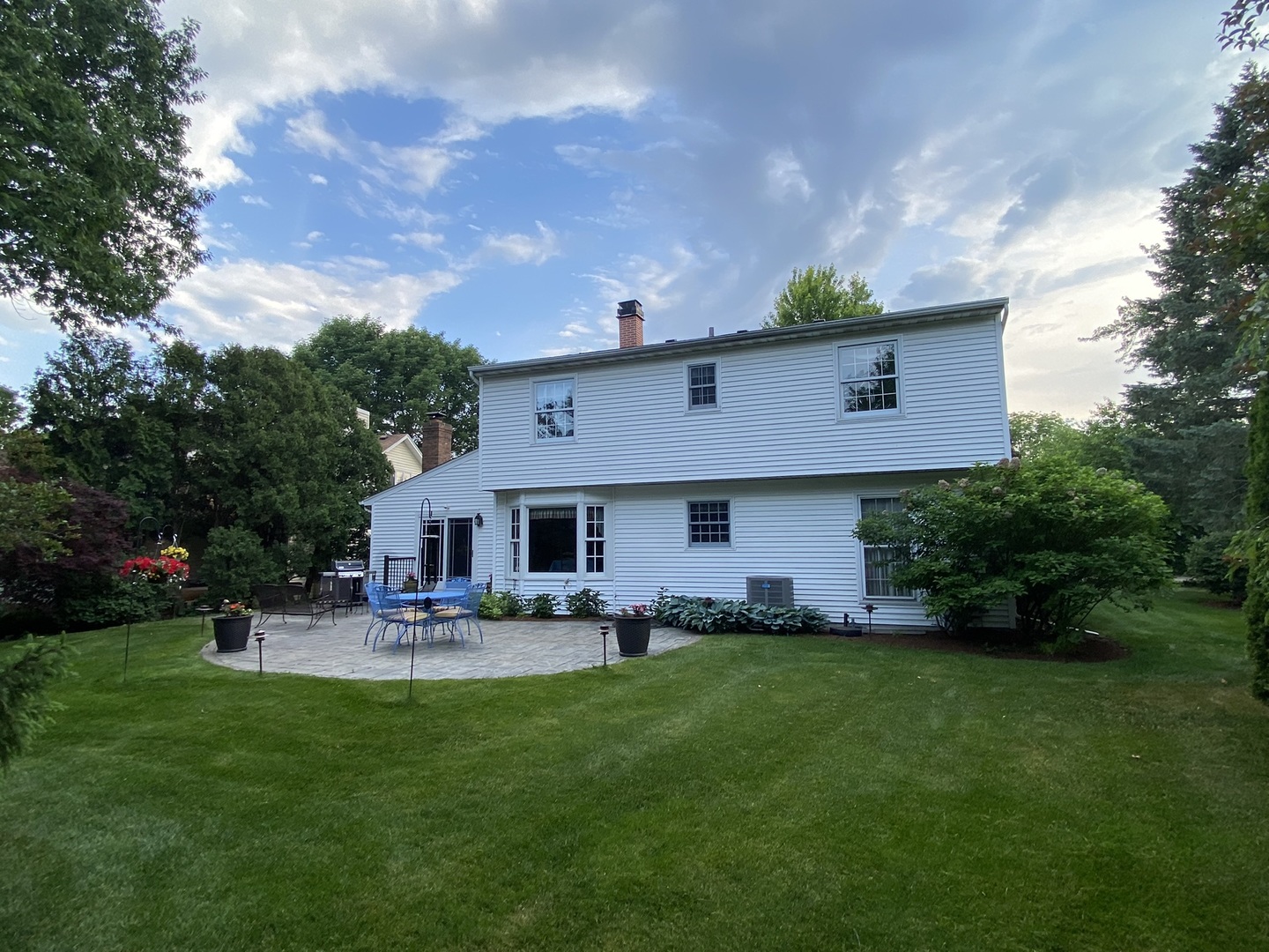 930 Appomattox Circle Naperville, IL 60540 - Photo 2 of 29 a front view of house with garden and outdoor seating