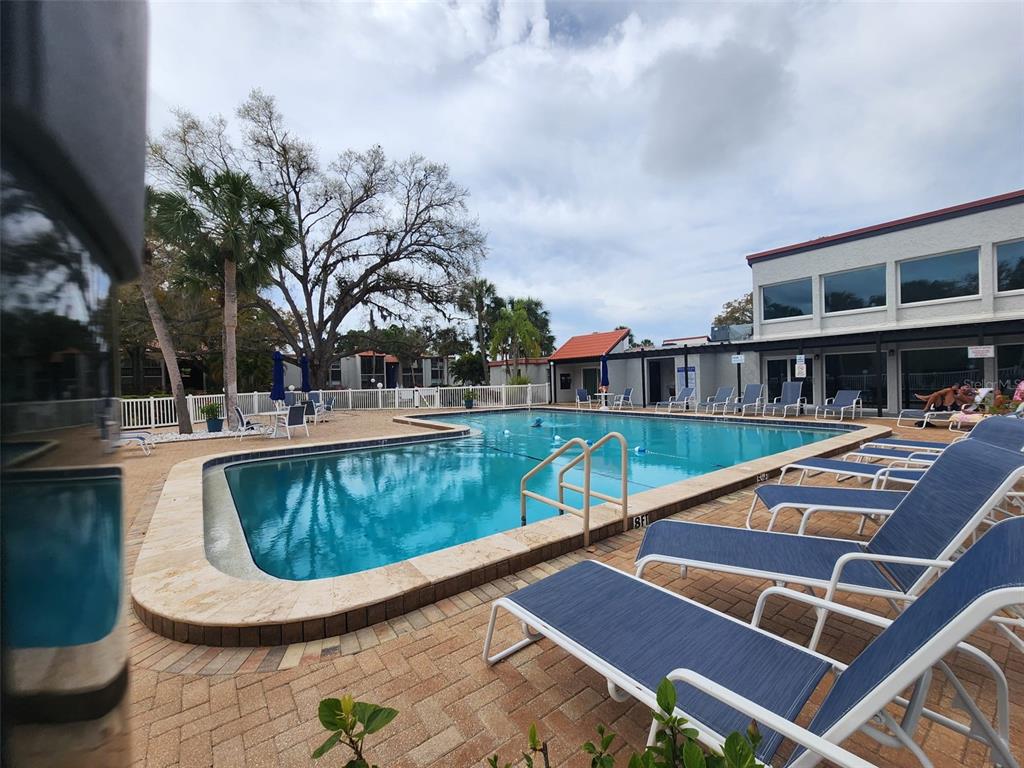 3249 South Beneva Road, Unit 204 Sarasota, FL 34232 - Photo 12 of 44 a view of a swimming pool with a patio