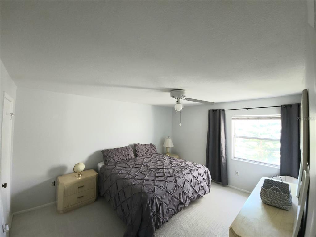 3249 South Beneva Road, Unit 204 Sarasota, FL 34232 - Photo 17 of 44 a bedroom with a bed and a window