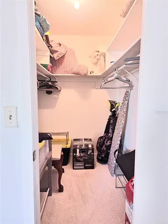 a bedroom with a bed and a mirror