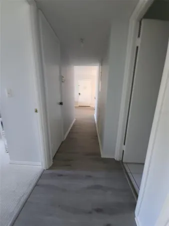 a white toilet sitting next to a bath tub