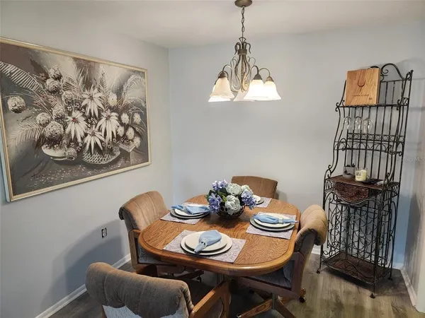 a living room with furniture and a chair