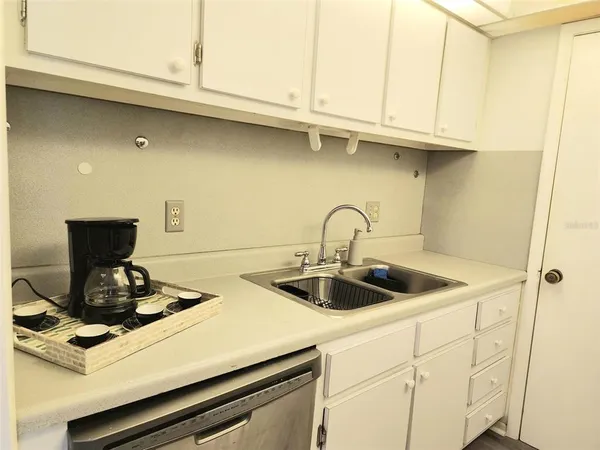 a stove top oven sitting inside of a kitchen