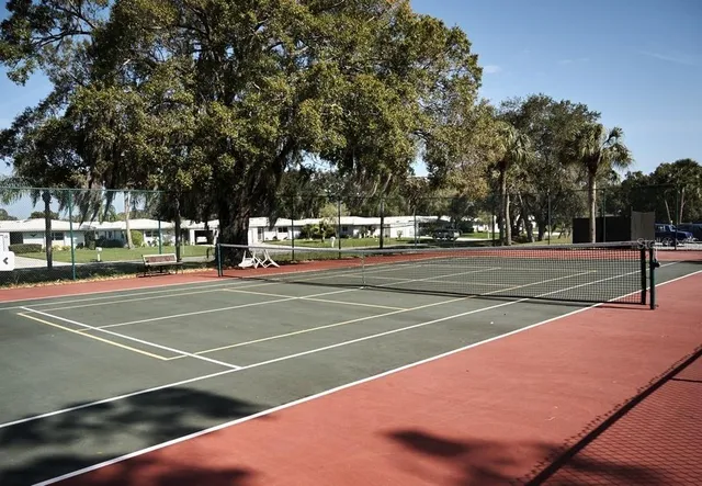 a view of city street with trees and buildings