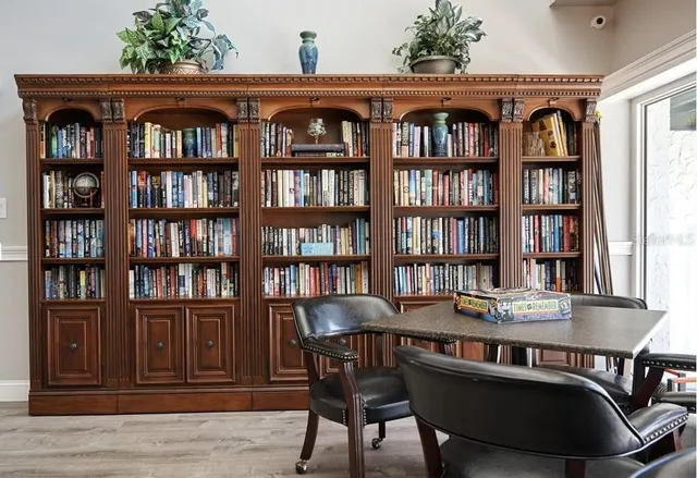 a view of a dining room with furniture and chandelier