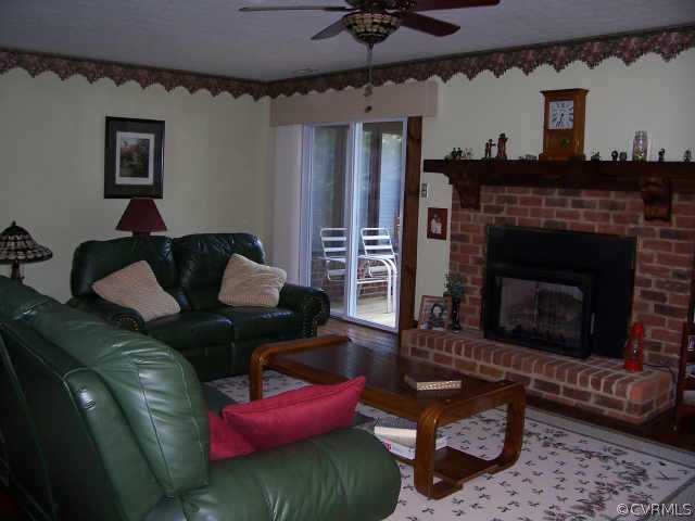 12518 2nd Branch Road Chesterfield, VA 23838 - Photo 3 of 8 a living room with furniture and a fireplace
