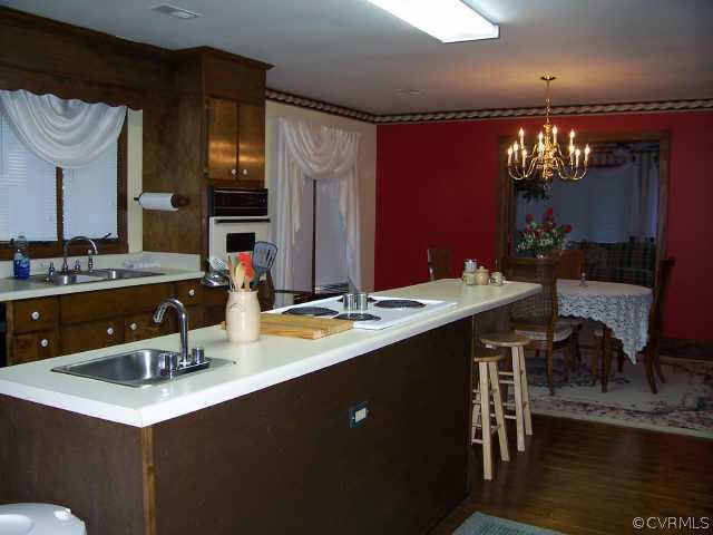 12518 2nd Branch Road Chesterfield, VA 23838 - Photo 4 of 8 a kitchen with a sink and a refrigerator