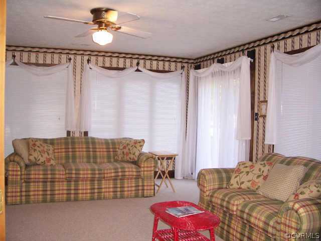 12518 2nd Branch Road Chesterfield, VA 23838 - Photo 5 of 8 a bedroom with bed and a couch