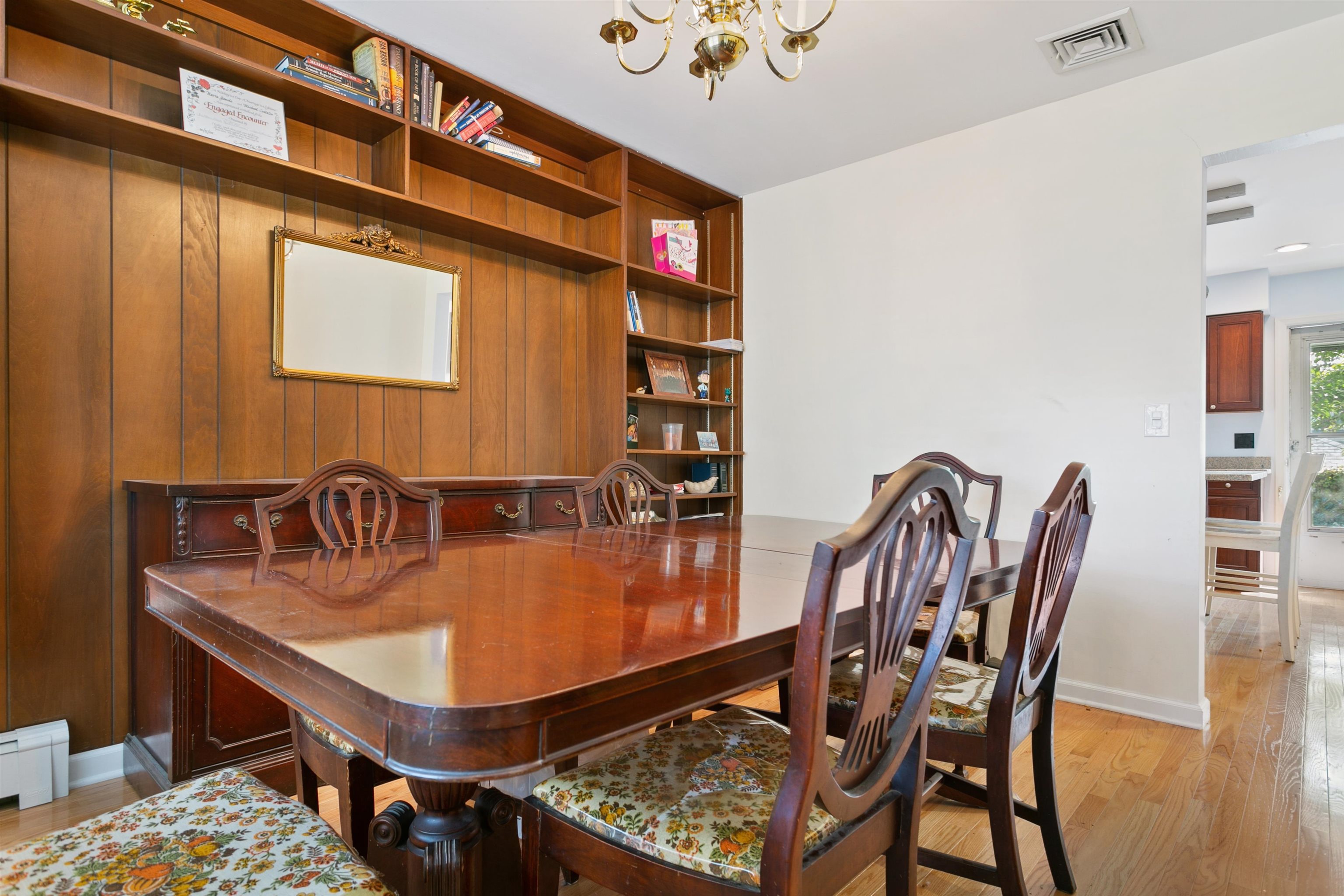 39 Raymond Avenue Rutherford, NJ 07070 - Photo 2 of 15 a table and chairs in a room