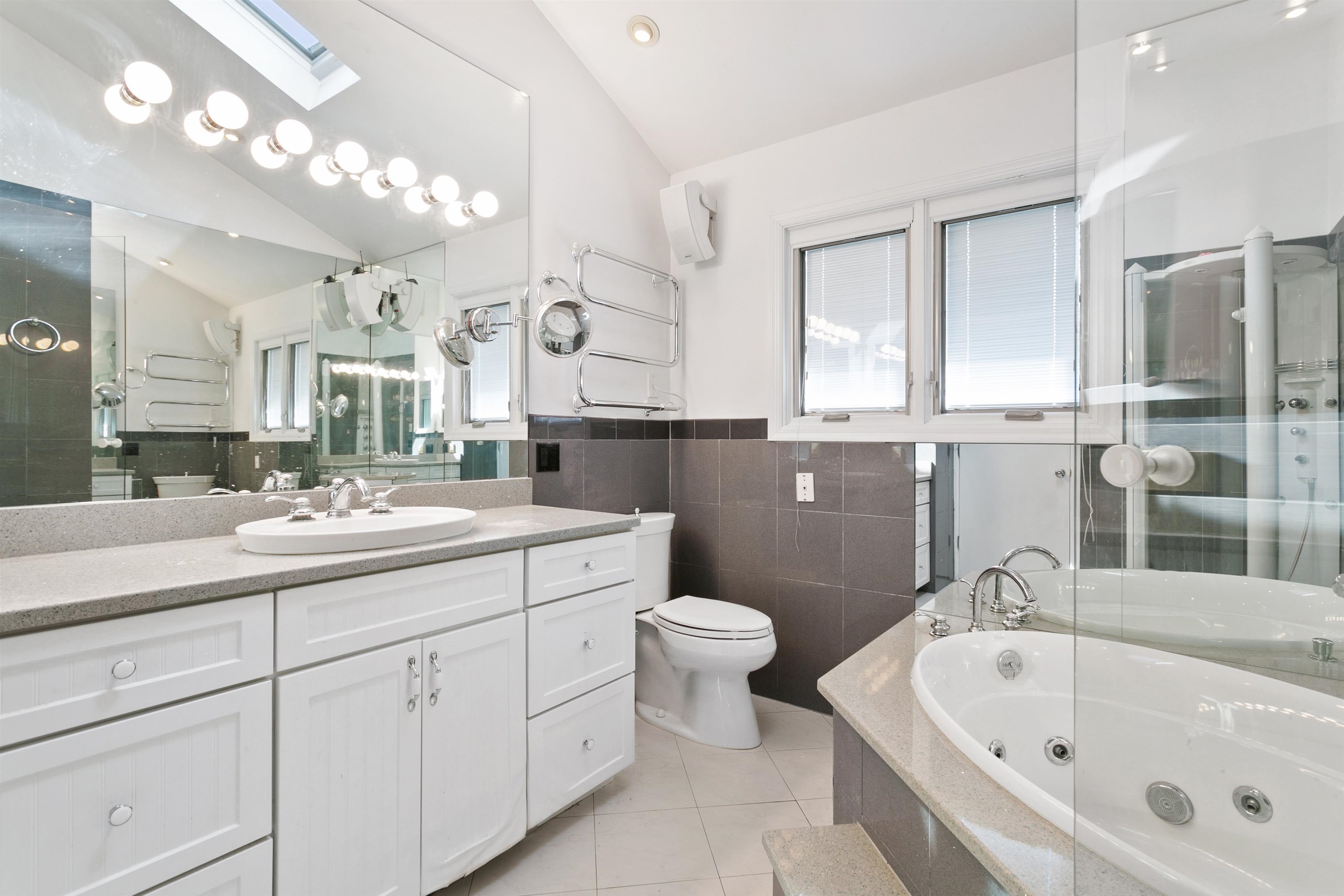 39 Raymond Avenue Rutherford, NJ 07070 - Photo 14 of 15 a bathroom with a bathtub sink mirror and toilet