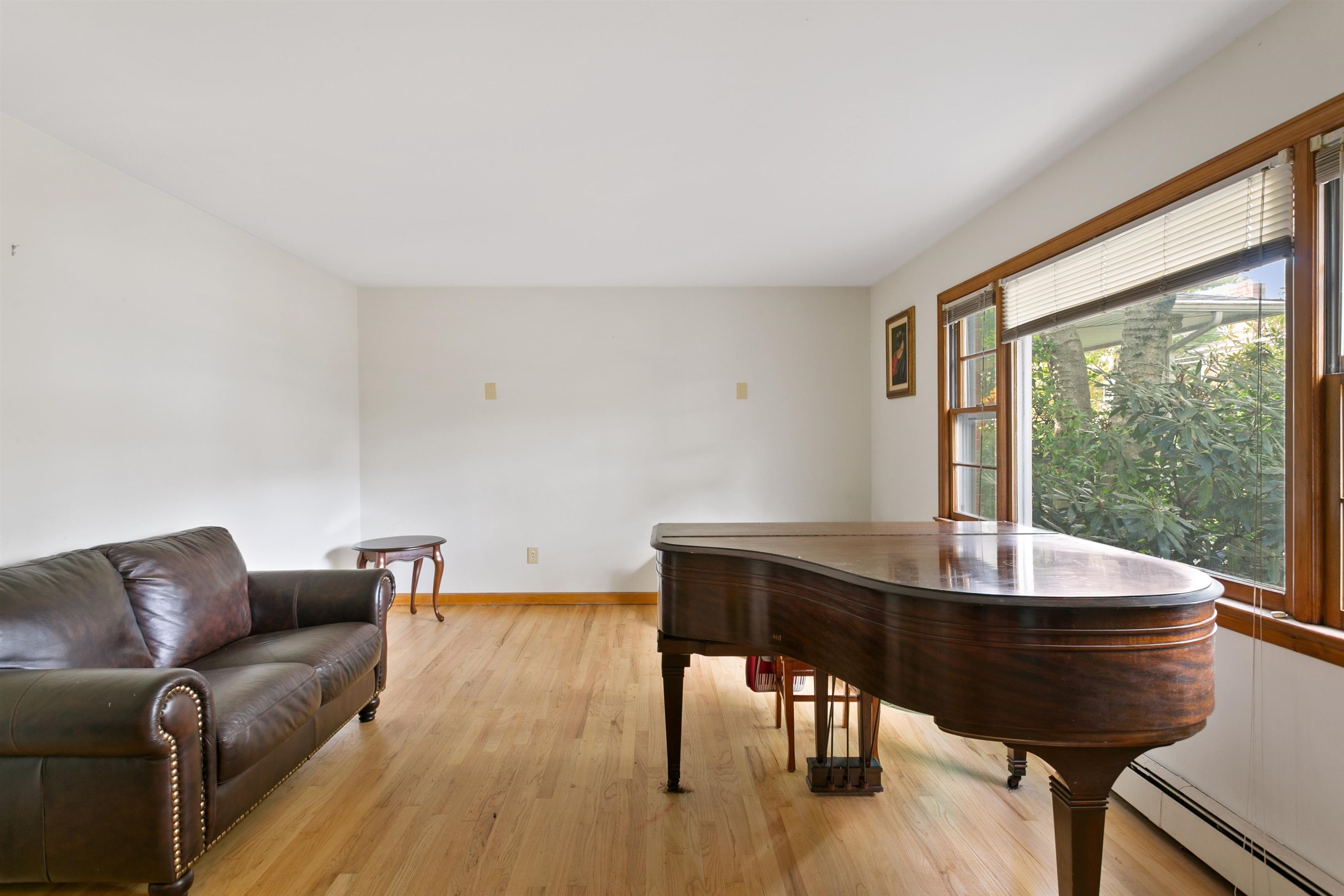 39 Raymond Avenue Rutherford, NJ 07070 - Photo 3 of 15 a living room with furniture a table and a large window