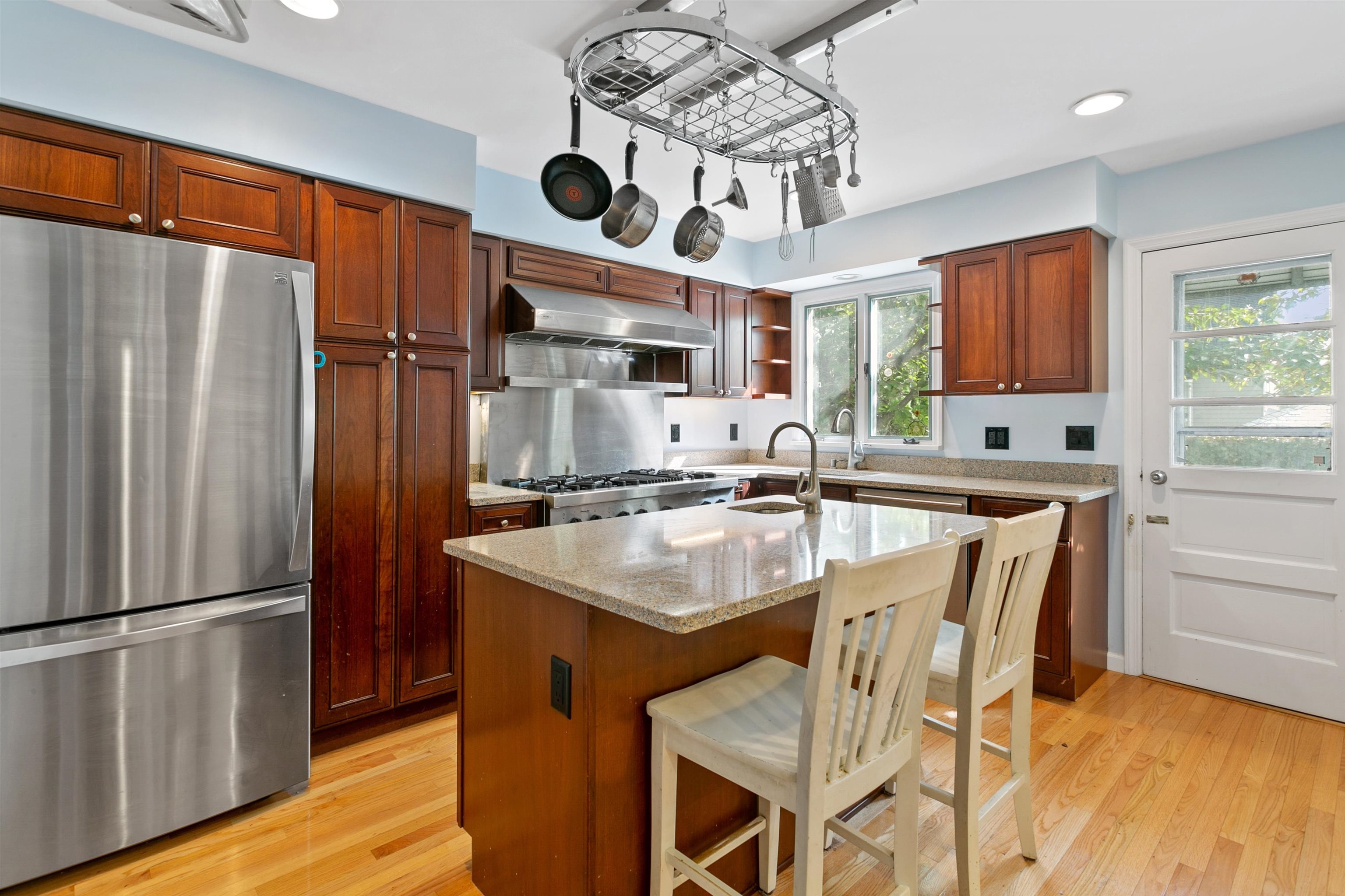39 Raymond Avenue Rutherford, NJ 07070 - Photo 4 of 15 a kitchen with stainless steel appliances granite countertop a sink refrigerator and microwave