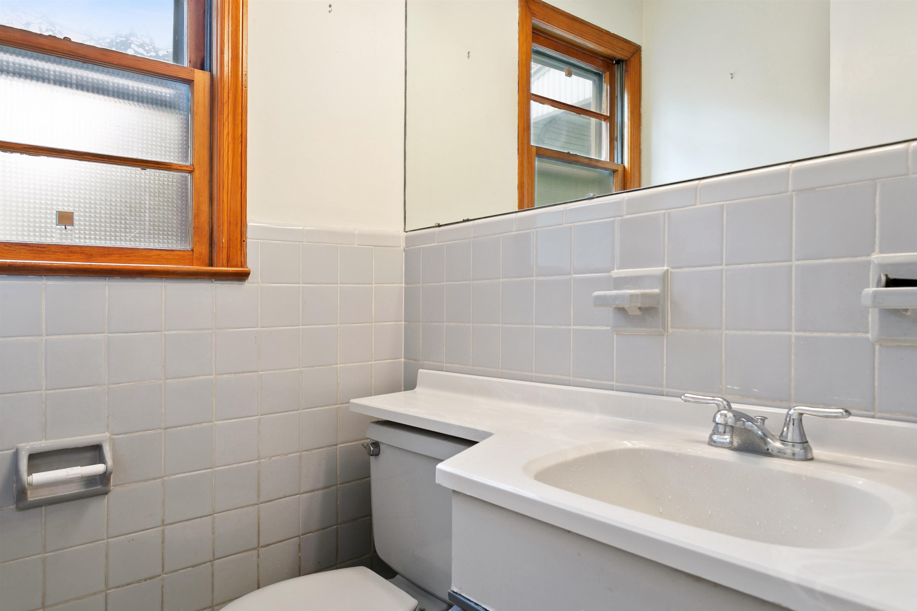 39 Raymond Avenue Rutherford, NJ 07070 - Photo 8 of 15 a bathroom with a sink a toilet and mirror