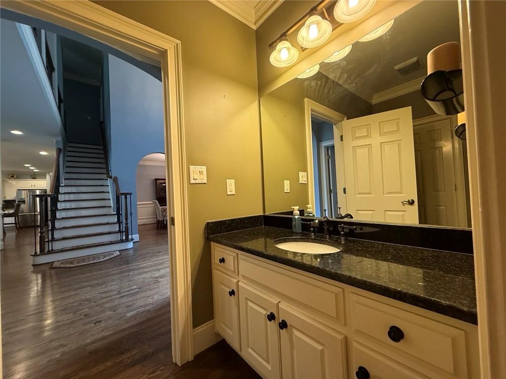 8350 Jacobs Ridge Lane Cumming, GA 30028 - Photo 11 of 68 a bathroom with a granite countertop sink and a mirror