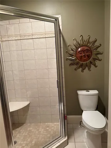 a living room with furniture fireplace and a large window