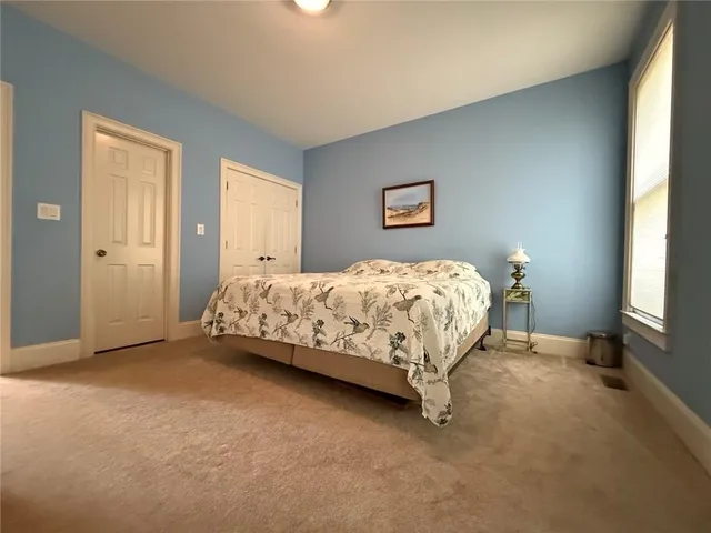 a living room with fireplace furniture and a flat screen tv