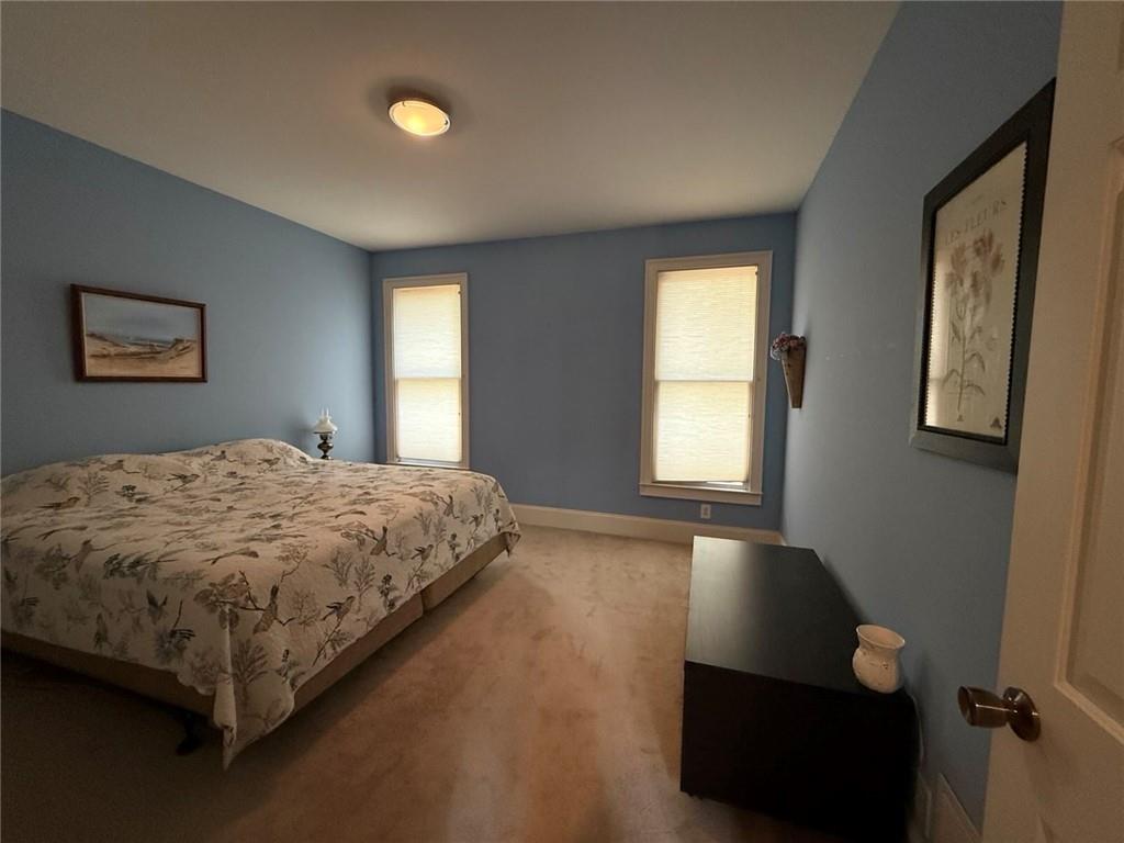 8350 Jacobs Ridge Lane Cumming, GA 30028 - Photo 14 of 68 a bedroom with a bed and window