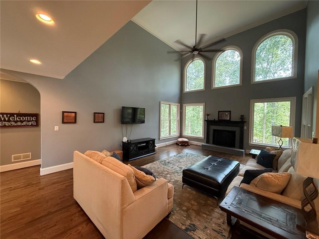 8350 Jacobs Ridge Lane Cumming, GA 30028 - Photo 15 of 68 a living room with furniture fireplace and a large window