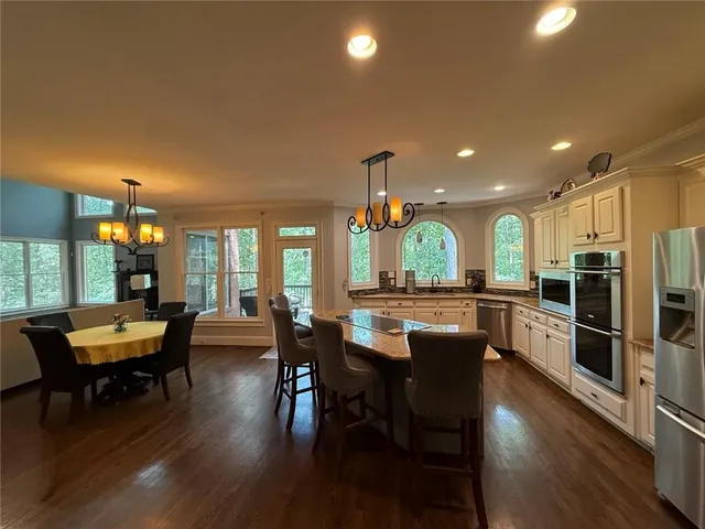 a living room with fireplace furniture and a flat screen tv