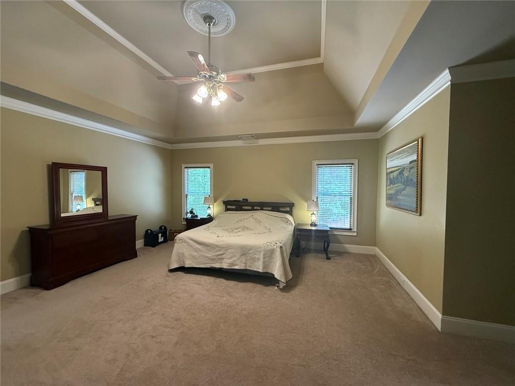 8350 Jacobs Ridge Lane Cumming, GA 30028 - Photo 21 of 68 a spacious bedroom with a bed and window