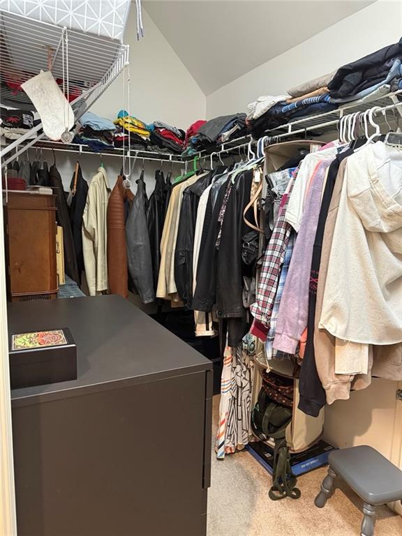 8350 Jacobs Ridge Lane Cumming, GA 30028 - Photo 23 of 68 a view of walk in closet with clothes and shoes