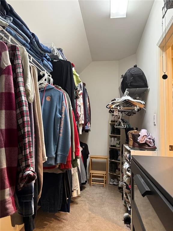 8350 Jacobs Ridge Lane Cumming, GA 30028 - Photo 24 of 68 a view of walk in closet with clothes and shoes