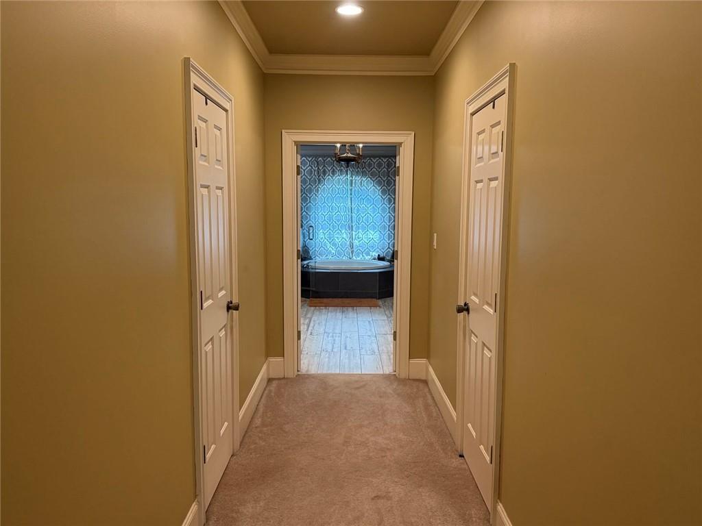 8350 Jacobs Ridge Lane Cumming, GA 30028 - Photo 26 of 68 a view of a hallway with wooden floor and closet