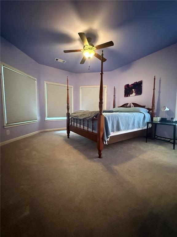 8350 Jacobs Ridge Lane Cumming, GA 30028 - Photo 34 of 68 a bedroom with a bed and a chandelier