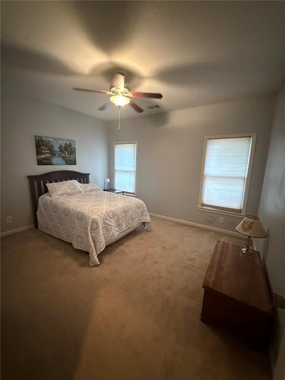 8350 Jacobs Ridge Lane Cumming, GA 30028 - Photo 36 of 68 a bedroom with a bed and a window