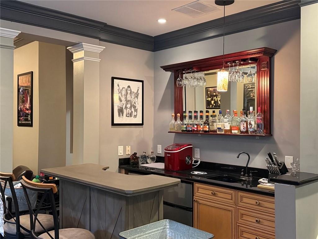 8350 Jacobs Ridge Lane Cumming, GA 30028 - Photo 40 of 68 a kitchen with stainless steel appliances a stove a sink and cabinets