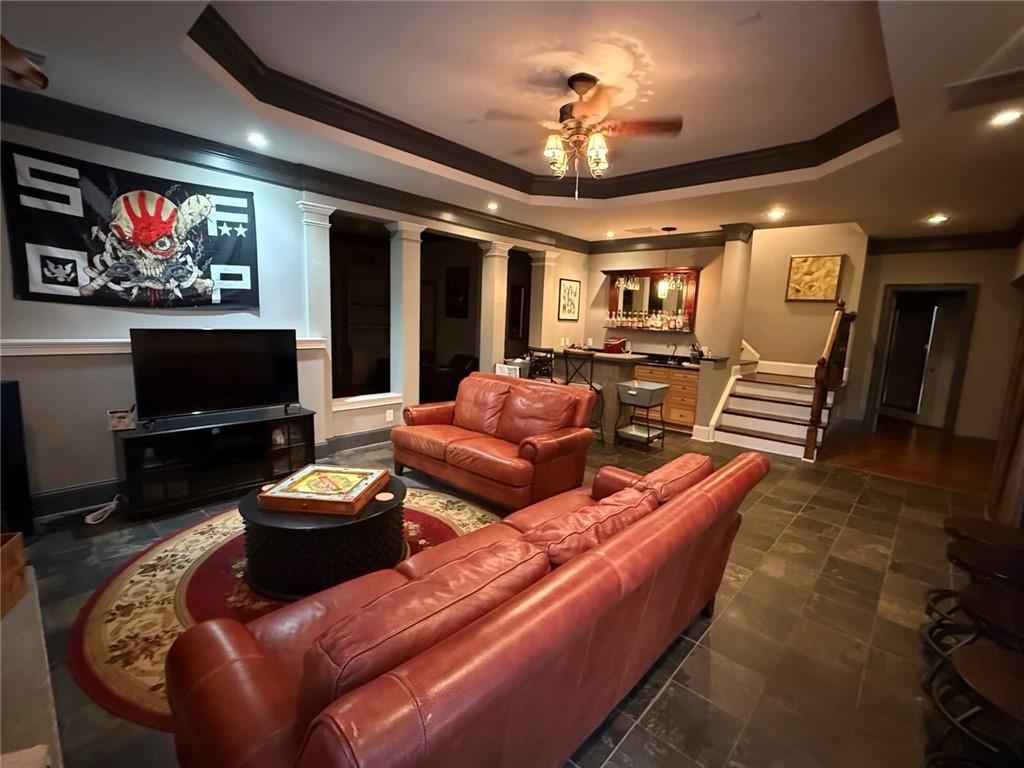 8350 Jacobs Ridge Lane Cumming, GA 30028 - Photo 41 of 68 a living room with furniture and a flat screen tv