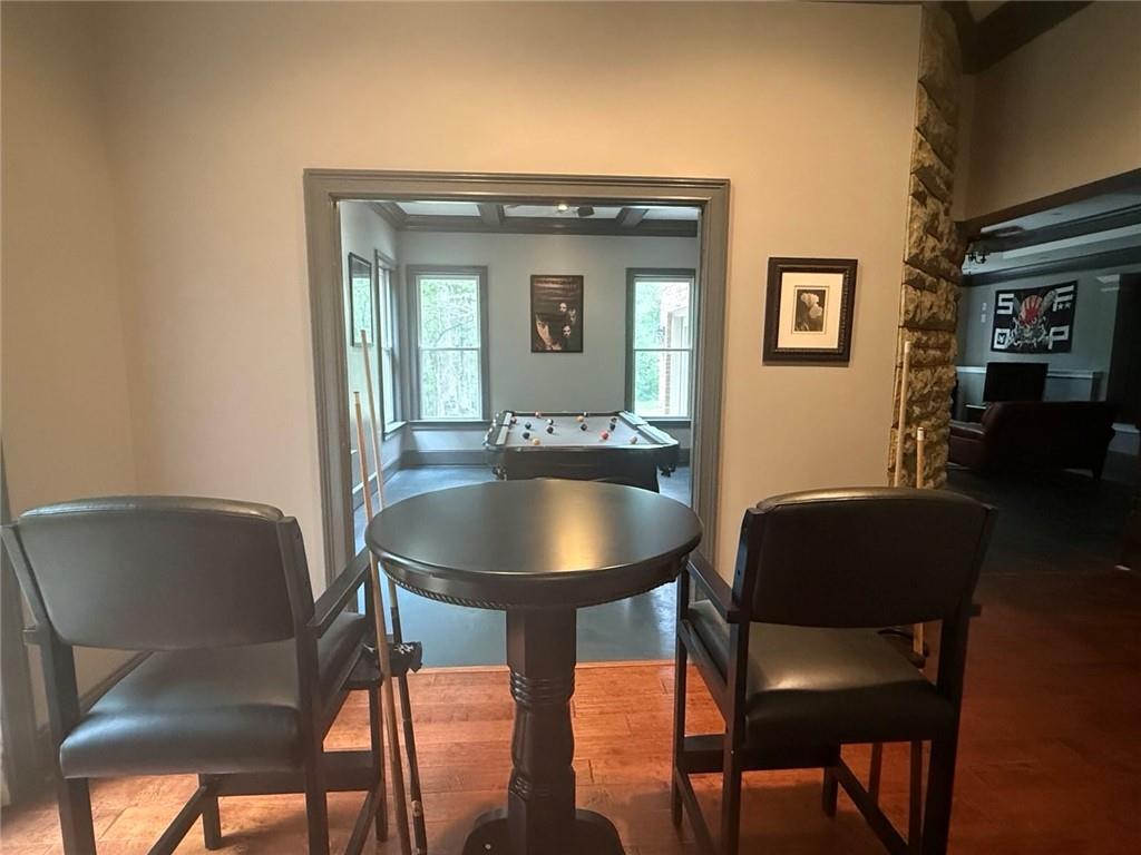 8350 Jacobs Ridge Lane Cumming, GA 30028 - Photo 44 of 68 a view of a dining room with furniture and wooden floor
