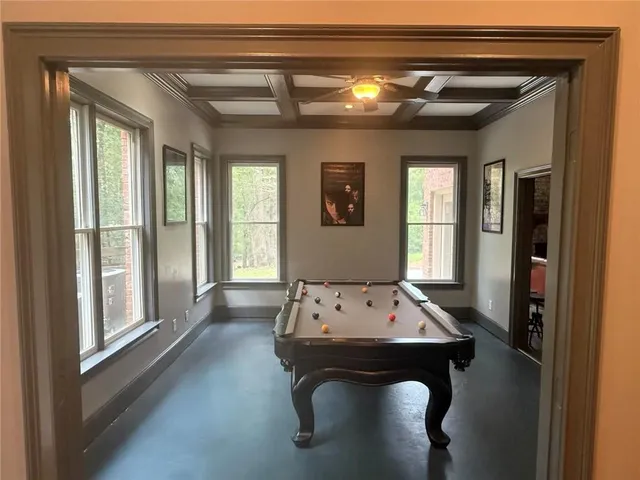 a view of a park with large trees and a pathway
